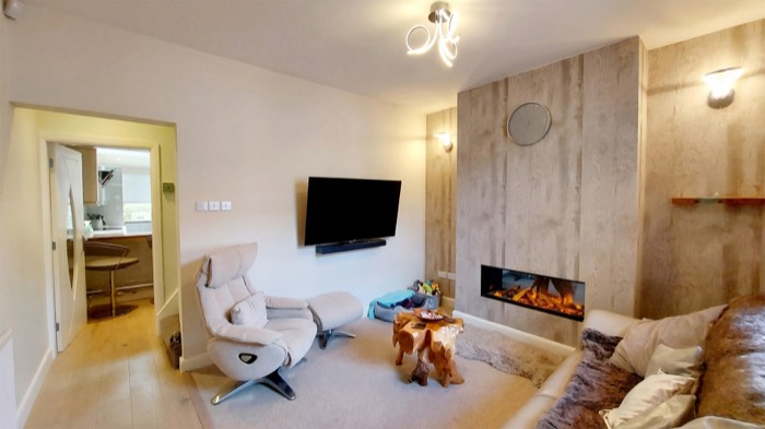 Living room with fireplace renovated in Fuengirola by Legacy Construction